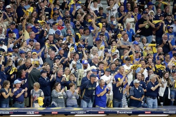 Brewers fans wave the yellow towel during Game One of the National League division series against the Atlanta Braves at American Family Field on...