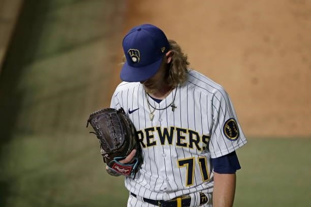 Josh Hader of the Milwaukee Brewers enters the game in the ninth inning against the Atlanta Braves during Game One of the National League division...