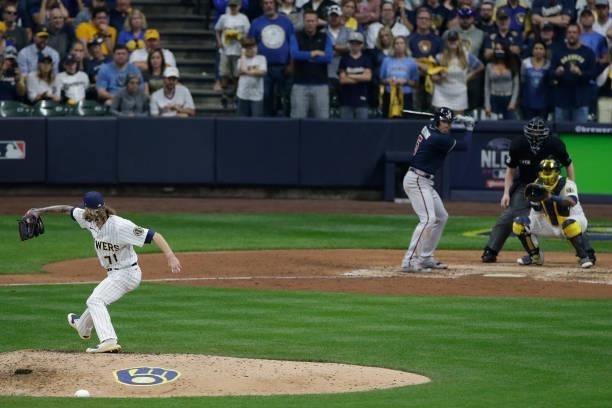 Josh Hader of the Milwaukee Brewers throws a pitch in the ninth inning against the Atlanta Braves during Game One of the National League division...