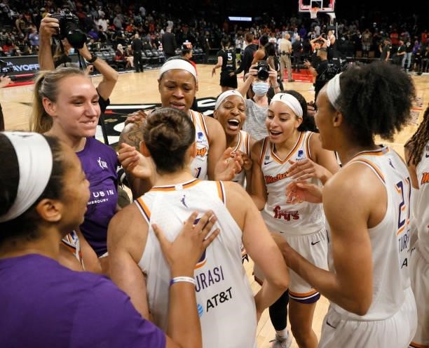 The Phoenix Mercury celebrate after defeating the Las Vegas Aces 87-84 in Game Five of the 2021 WNBA Playoffs semifinals to win the series at...