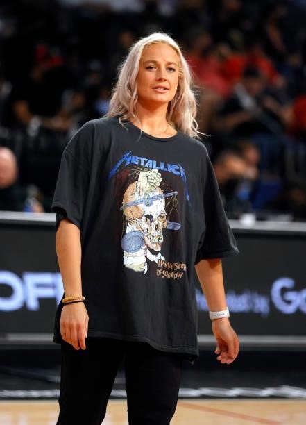 Sophie Cunningham of the Phoenix Mercury wears a Metallica concert T-Shirt as she watches teammates warm up before Game Five of the 2021 WNBA...