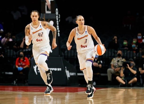 Diana Taurasi of the Phoenix Mercury brings the ball up the court against the Las Vegas Aces ahead of teammate Brittney Griner during Game Five of...