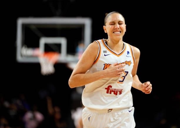 Diana Taurasi of the Phoenix Mercury grimaces as she runs on the court after she was hurt on a play during Game Five of the 2021 WNBA Playoffs...