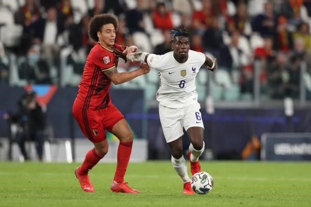 Paul Pogba of France holds off the challenge from Axel Witsel of Belgium during the UEFA Nations League 2021 Semi-final match between Belgium and...