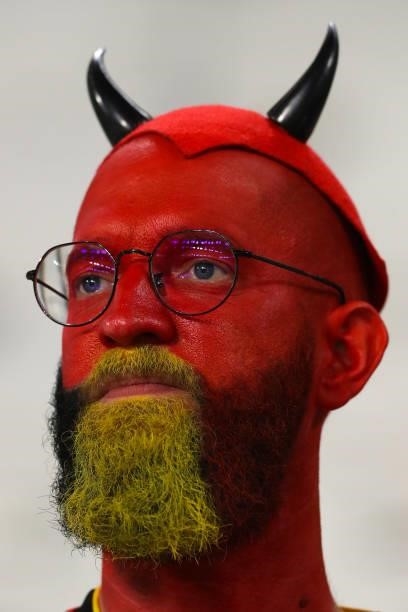 Belgium fan with his face painted and wearing a Devil hat looks on during the UEFA Nations League 2021 Semi-final match between Belgium and France at...