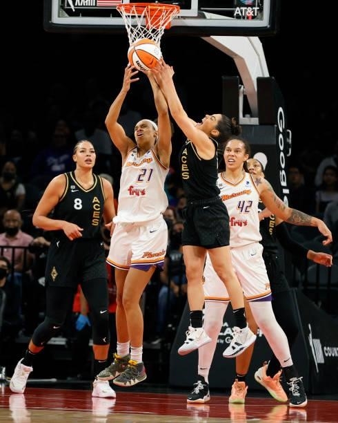Brianna Turner of the Phoenix Mercury and Kelsey Plum of the Las Vegas Aces vie for the ball as Liz Cambage of the Aces and Brittney Griner of the...