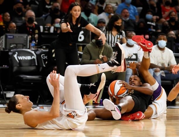 Diana Taurasi of the Phoenix Mercury, Jackie Young of the Las Vegas Aces and Shey Peddy of the Mercury scramble for a loose ball during Game Five of...
