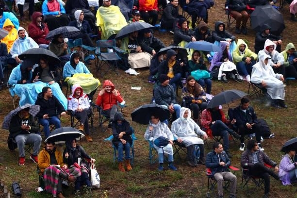 Fans shelter from the rain during final practice ahead of the F1 Grand Prix of Turkey at Intercity Istanbul Park on October 09, 2021 in Istanbul,...