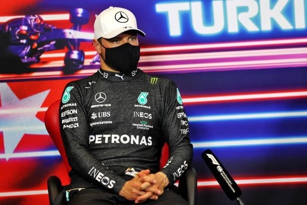 Second placed qualifier Valtteri Bottas of Finland and Mercedes GP talks in the press conference after qualifying ahead of the F1 Grand Prix of...