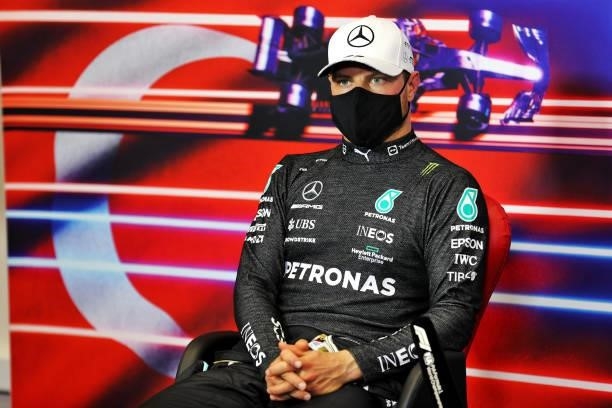 Second placed qualifier Valtteri Bottas of Finland and Mercedes GP talks in the press conference after qualifying ahead of the F1 Grand Prix of...