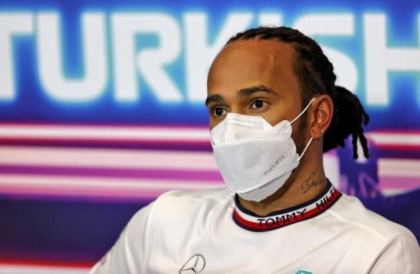 Pole position qualifier Lewis Hamilton of Great Britain and Mercedes GP talks in the press conference after qualifying ahead of the F1 Grand Prix of...