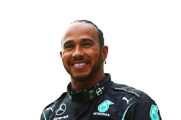 Lewis Hamilton of Great Britain driving the Mercedes AMG Petronas F1 Team Mercedes W12 smiles in parc ferme after qualifying ahead of the F1 Grand...