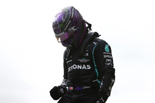 Lewis Hamilton of Great Britain driving the Mercedes AMG Petronas F1 Team Mercedes W12 celebrates in parc ferme after qualifying ahead of the F1...