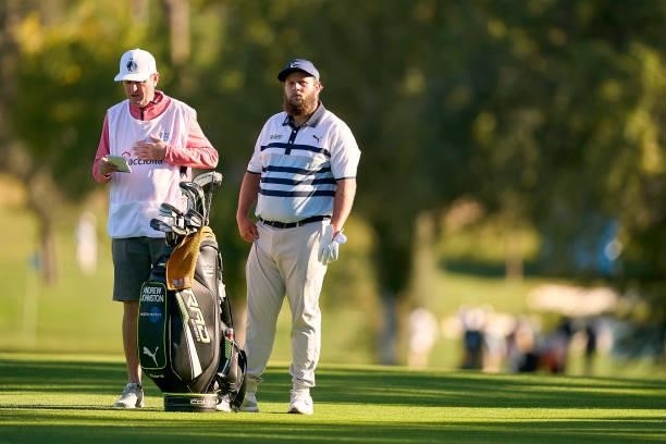 Andrew Johnston of England talks with his caddie during Day Three of The Open de Espana at Club de Campo Villa de Madrid on October 09, 2021 in...