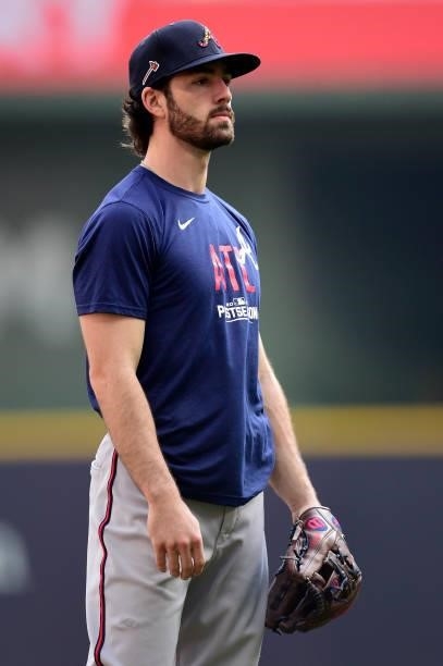 Dansby Swanson of the Atlanta Braves warms up prior to game 2 of the National League Division Series against the Milwaukee Brewers at American Family...