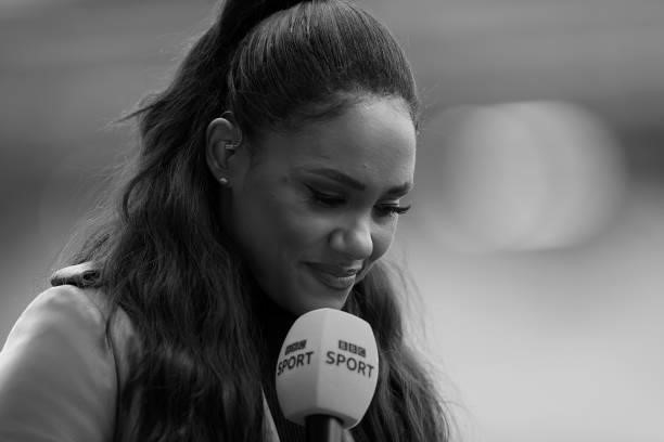 Presenter and former football player Alex Scott speaks prior to during the Barclays FA Women's Super League match between Manchester United Women and...