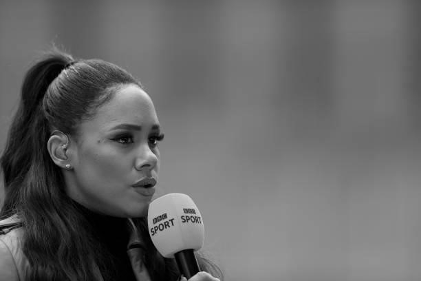 Presenter and former football player Alex Scott speaks prior to during the Barclays FA Women's Super League match between Manchester United Women and...