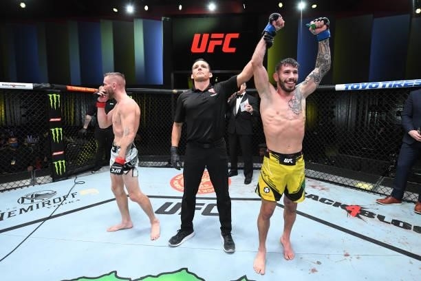 Matheus Nicolau of Brazil celebrates his victory over Tim Elliott in their flyweight bout during the UFC Fight Night event at UFC APEX on October 09,...
