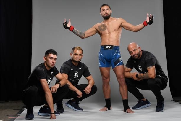 Chris Gutierrez poses for a portrait backstage with his team during the UFC Fight Night event at UFC APEX on October 09, 2021 in Las Vegas, Nevada.