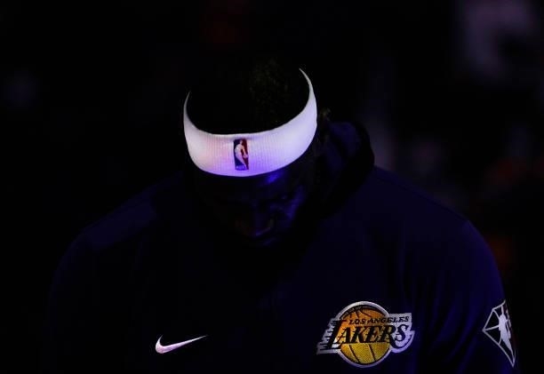 Detailed view of the logos on the warm ups worn by LeBron James of the Los Angeles Lakers while he stands during the singing of the National Anthem...