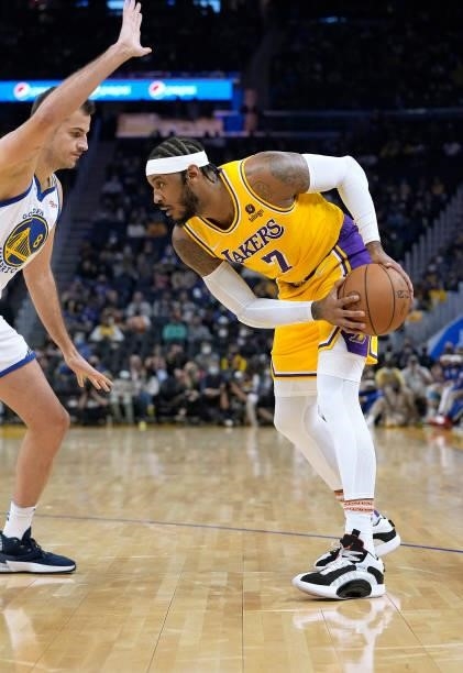 Carmelo Anthony of the Los Angeles Lakers looks to put a move on Nemanja Bjelica of the Golden State Warriors at Chase Center on October 08, 2021 in...