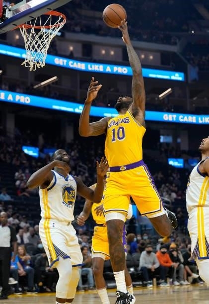 DeAndre Jordan of the Los Angeles Lakers shoots over Draymond Green of the Golden State Warriors at Chase Center on October 08, 2021 in San...