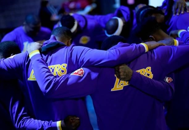 The Los Angeles Lakers lakers gather together for a prayer outside the locker room prior to playing the Golden State Warriors at Chase Center on...