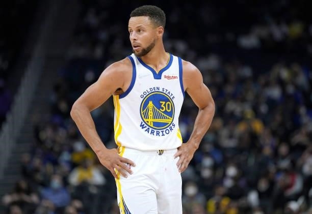 Stephen Curry of the Golden State Warriors looks on against the Los Angeles Lakers at Chase Center on October 08, 2021 in San Francisco, California....