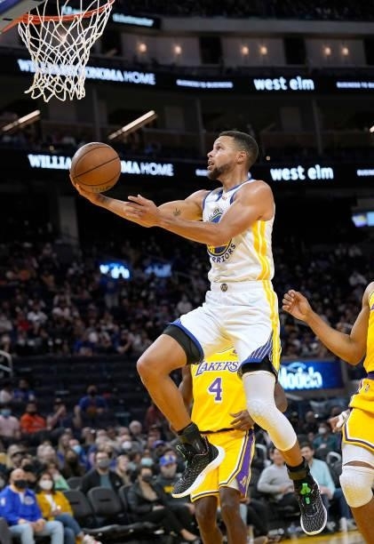 Stephen Curry of the Golden State Warriors shoots a layup against the Los Angeles Lakers at Chase Center on October 08, 2021 in San Francisco,...