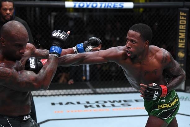 Randy Brown of Jamaica punches Jared Gooden in their welterweight bout during the UFC Fight Night event at UFC APEX on October 09, 2021 in Las Vegas,...