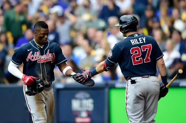 Jorge Soler of the Atlanta Braves celebrates scoring a run with Austin Riley of the Atlanta Braves in the third inning during game 2 of the National...