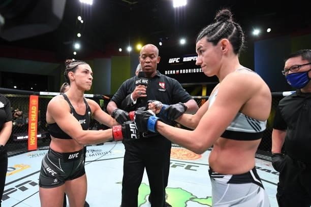 Marina Rodriguez of Brazil and Mackenzie Dern touch gloves in their women's strawweight bout during the UFC Fight Night event at UFC APEX on October...