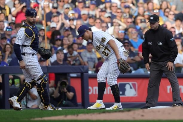 Willy Adames of the Milwaukee Brewers kicks a ball foul in the second inning during game 2 of the National League Division Series against the Atlanta...