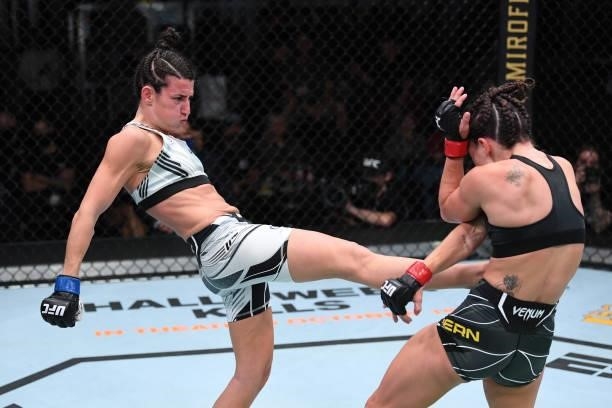 Marina Rodriguez of Brazil kicks Mackenzie Dern in their women's strawweight bout during the UFC Fight Night event at UFC APEX on October 09, 2021 in...