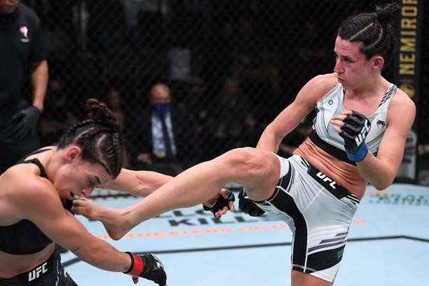 Marina Rodriguez of Brazil kicks Mackenzie Dern in their women's strawweight bout during the UFC Fight Night event at UFC APEX on October 09, 2021 in...