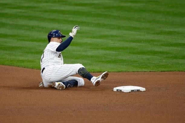 Willy Adames of the Milwaukee Brewers slides into second after hitting a double in the sixth inning during game 2 of the National League Division...