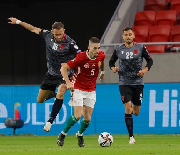 Sokol Cikalleshi of Albania challenges Zsolt Nagy of Hungary before Nedim Bajrami of Albania during the FIFA World Cup 2022 Qatar Qualifier match...
