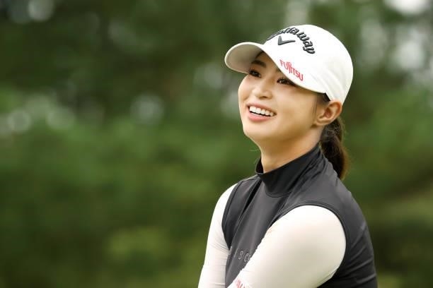 Asuka Kashiwabara of Japan smiles on the 1st tee during the final round of the Stanley Ladies at Tomei Country Club on October 10, 2021 in Susono,...