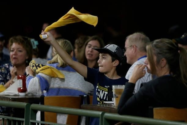 Young Milwaukee Brewers fan cheers on his team in the seventh inning during game 2 of the National League Division Series against the Atlanta Braves...