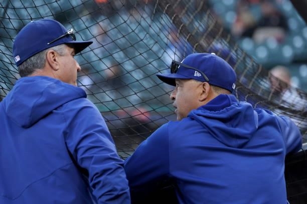 Bench coach Bob Geren and manager Dave Roberts of the Los Angeles Dodgers meet before Game 2 of the National League Division Series against the San...