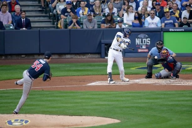 Christian Yelich of the Milwaukee Brewers singles in the second inning during game 2 of the National League Division Series against the Atlanta...