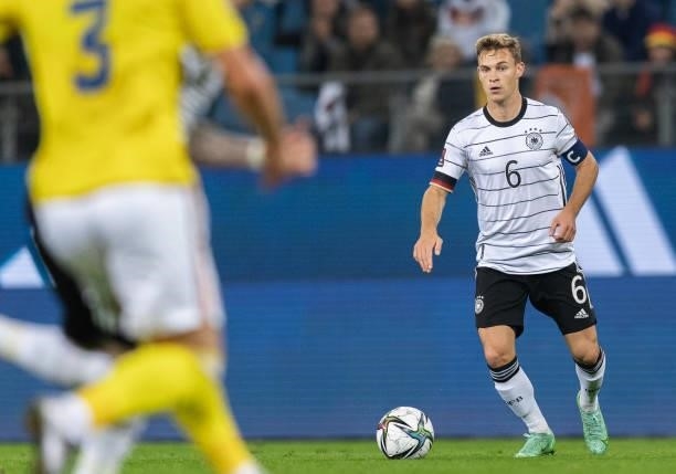 Joshua Kimmich of Germany runs with the ball during the 2022 FIFA World Cup Qualifier match between Germany and Romania at Imtech Arena on October...