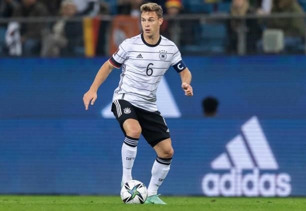 Joshua Kimmich of Germany runs with the ball during the 2022 FIFA World Cup Qualifier match between Germany and Romania at Imtech Arena on October...