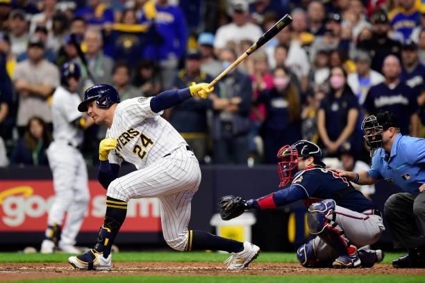 Avisail Garcia of the Milwaukee Brewers strikes out in the eighth inning during game 2 of the National League Division Series against the Atlanta...