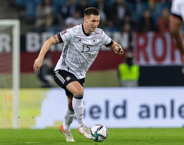 Niklas Suele of Germany runs with the ball during the 2022 FIFA World Cup Qualifier match between Germany and Romania at Imtech Arena on October 08,...