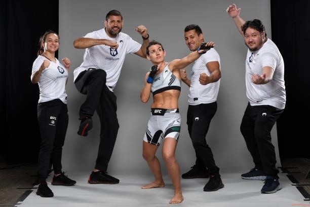 Marina Rodriguez of Brazil poses for a portrait backstage with her team during the UFC Fight Night event at UFC APEX on October 09, 2021 in Las...