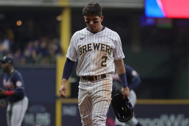 Luis Urias of the Milwaukee Brewers walks off the field after a loss to the Atlanta Braves during game 2 of the National League Division Series at...