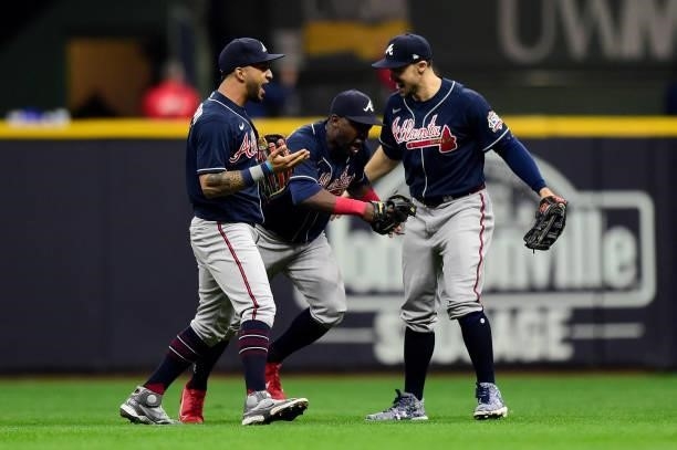 Guillermo Heredia of the Atlanta Braves celebrates with his teammates after a win over the Milwaukee Brewers during game 2 of the National League...
