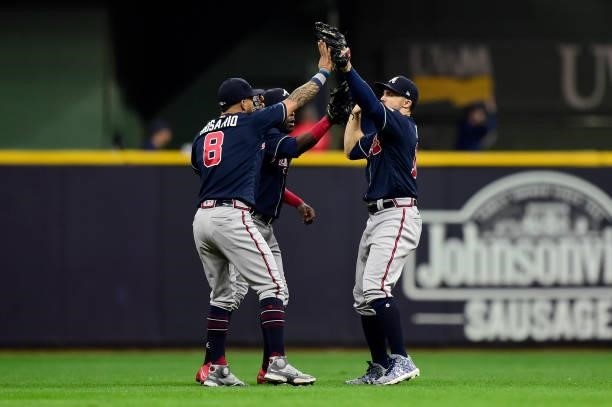 The Atlanta Braves outfielder celebrate a win over the Milwaukee Brewers during game 2 of the National League Division Series at American Family...