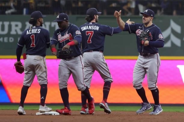 The Atlanta Braves celebrate a win over the Milwaukee Brewers during game 2 of the National League Division Series at American Family Field on...